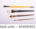 Art brushes of different sizes on a white 64400401
