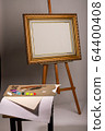 Oil painting. Easel and blank canvas. Palette with 64400408