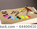 Oil painting. Palette with paints and brushes. The 64400410