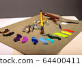 Oil painting. Palette with paints and brushes. The 64400411