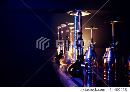 many hookahs with shisha glass flasks and metal bowls many hookahs with shisha glass flasks and metal bowls 64400458