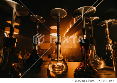 group of hookahs with shisha glass flasks and metal bowls group of hookahs with shisha glass flasks and metal bowls 64400462