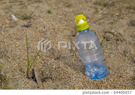 water bottle in the sand 64400857