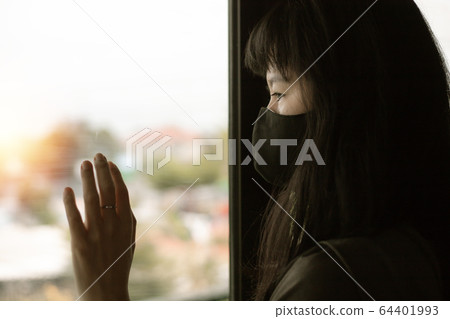 Asian woman staying home for self-quarantine and social distancing in coronavirus outbreak situation Asian woman staying home for self-quarantine and social distancing in coronavirus outbreak situation 64401993