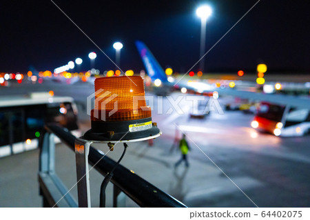Night photo, close-up, yellow beacon to attract 64402075