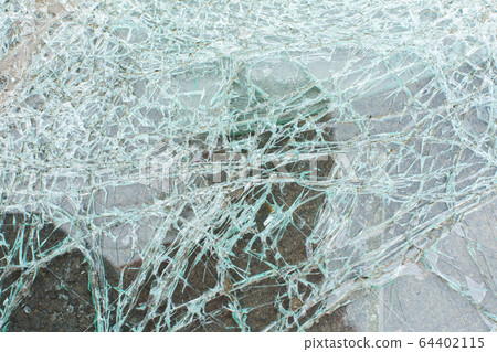 Broken car glass after an accident close up Broken car glass after an accident close up 64402115