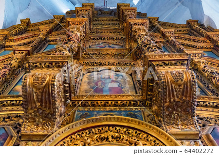 Wooden baroque iconostation inside old orthodox cathedral Wooden baroque iconostation inside old orthodox cathedral 64402272
