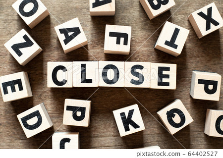 Wood letter block in word close on wood background Wood letter block in word close on wood background 64402527