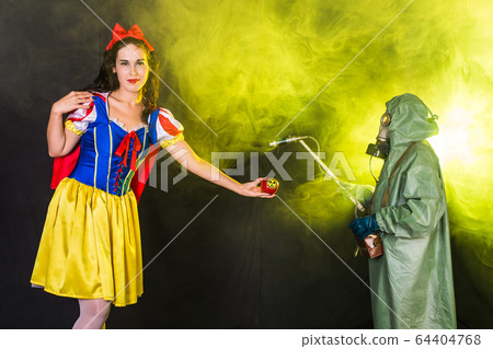 Danger, nuclear and radiation measurement - Girl holds apple with radiation hazard symbol. Danger, nuclear and radiation measurement - Girl holds apple with radiation hazard symbol. 64404768