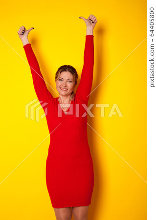 portrait of a beautiful woman of forty years her hands up portrait of a beautiful woman of forty years her hands up 64405800