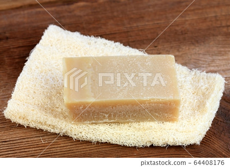 Bar of soap on the  washcloth, rustic style 64408176