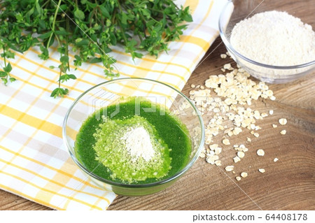 Homemade herb facial mask from  finely ground oat 64408178