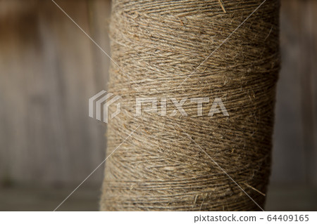 A roll of twine. Close-up. Selective focus. A roll of twine. Close-up. Selective focus. 64409165