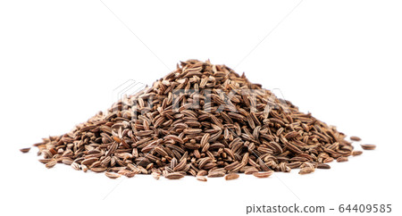 A pile of cumin seeds close-up on a white. A pile of cumin seeds close-up on a white. 64409585