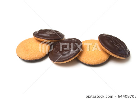 Closeup of chocolate cakes with jam pile on white 64409705