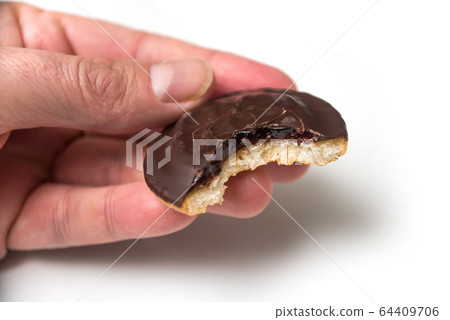 Closeup of crunched  chocolate cakes with jam  64409706