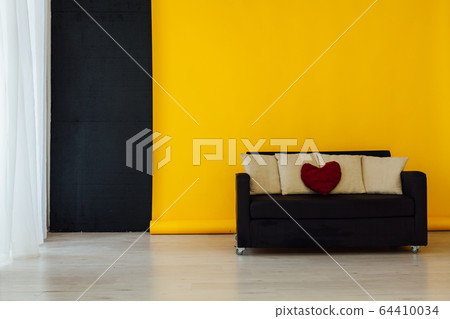 black office sofa in the interior of the room with a yellow background 64410034