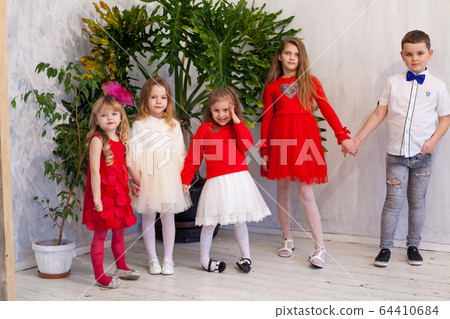 Boy with girls on holiday friends birthday 64410684