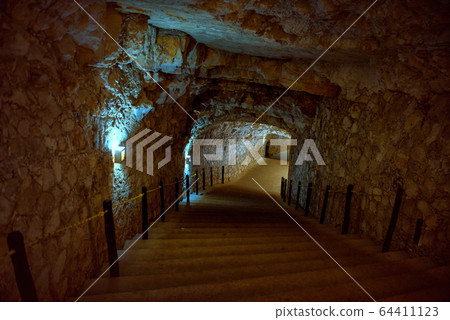 The tunnel cut through the rock. Cenote The tunnel cut through the rock. Cenote 64411123