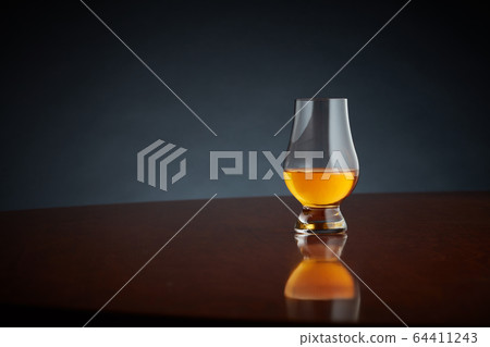 Whisky or whiskey or bourbon on wood background Whisky or whiskey or bourbon on wood background 64411243