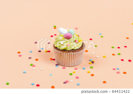 Easter pistachio cupcake with decorations Easter pistachio cupcake with decorations 64411422