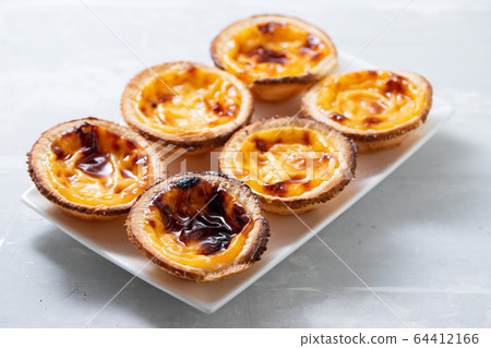 typical portuguese sweets pastel de nata on white 64412166