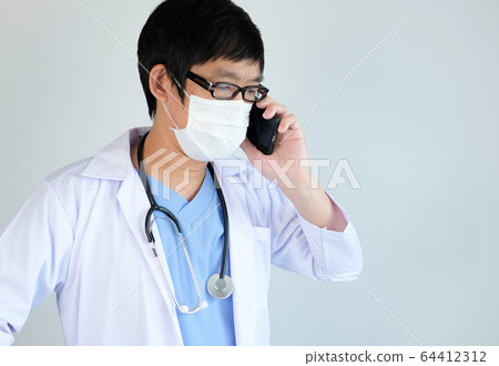 doctor use the mobile phone for corona virus , 64412312