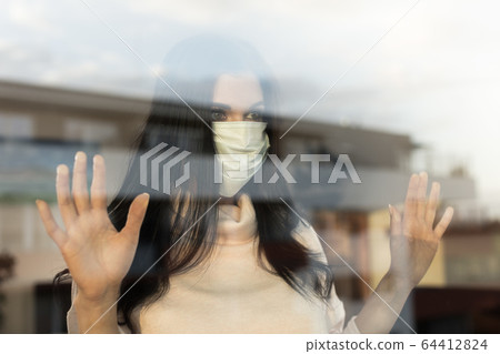 Young woman with veil, home isolation concept Young woman with veil, home isolation concept 64412824