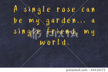 Chalk inscription of smart quote on black desk 64416573