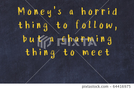 Chalk inscription of smart quote on black desk 64416975