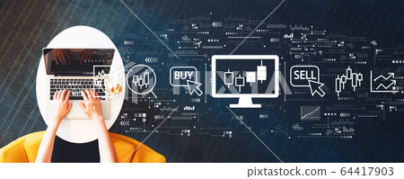 Stock trading theme with person using a laptop Stock trading theme with person using a laptop 64417903