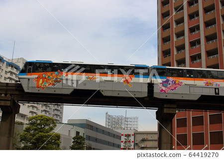Tokyo Monorail train passing by highrise apartments at Tokyo Bay 64419270