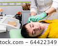 Preventive examination of a teenage boy in a medical facility.  64422349