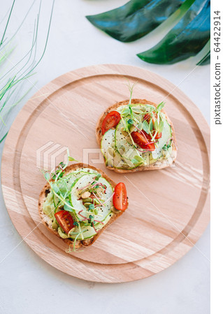 Tasty italian bruschetta on the wooden plate Tasty italian bruschetta on the wooden plate 64422914