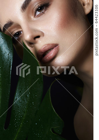 beautiful wet girl in palms. Beautiful woman with beautiful wet girl in palms. Beautiful woman with 64423386