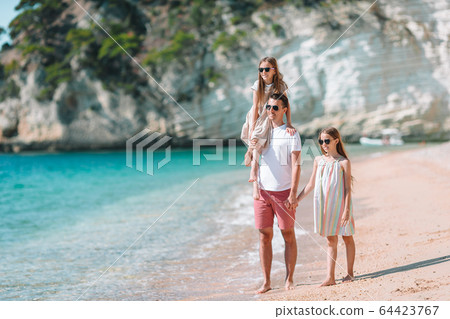 Father and kids enjoying beach summer vacation Father and kids enjoying beach summer vacation 64423767