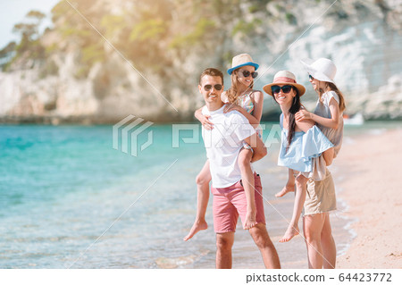 Young family on vacation have a lot of fun 64423772