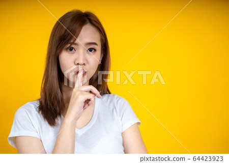 Young Asain woman requires silence. Young 64423923