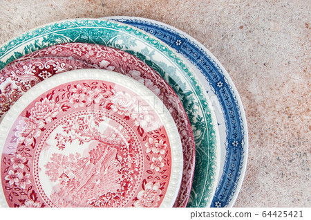 Antique porcelain dishes on concrete background. Antique porcelain dishes on concrete background. 64425421
