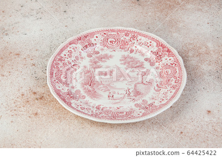 Antique porcelain dish on concrete background. Antique porcelain dish on concrete background. 64425422