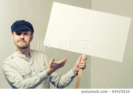 Angry protesting worker with blank protest sign Angry protesting worker with blank protest sign 64425610