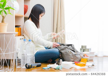 Rope: A woman who packs items for emergency use in her backpack Copy space 64426388