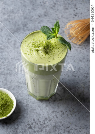 Dalgona Iced Matcha tea garnish mint on grey Dalgona Iced Matcha tea garnish mint on grey 64426504