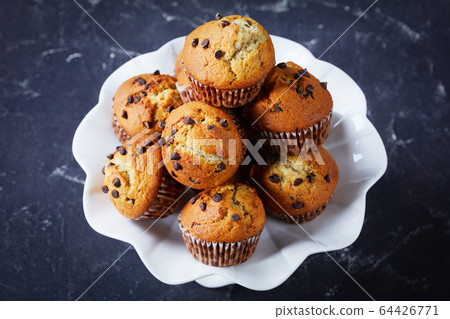 close-up of freshly baked chocolate chip muffins close-up of freshly baked chocolate chip muffins 64426771