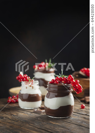 dessert with white and dark chocolate cream dessert with white and dark chocolate cream 64428080