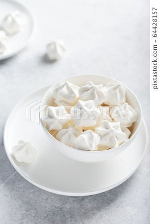 Sweet white meringue 64428157