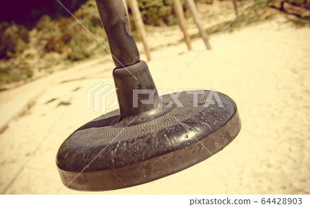 Zip wire with empty seat at playground Zip wire with empty seat at playground 64428903