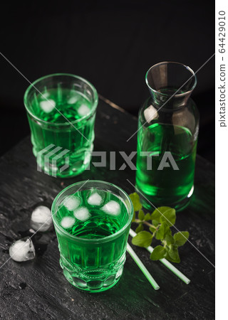 Alcoholic green cocktail Alcoholic green cocktail 64429010
