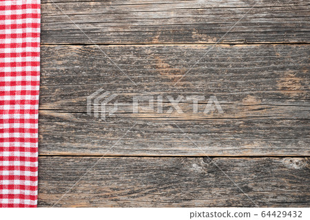 Wooden background with checkered textile Wooden background with checkered textile 64429432