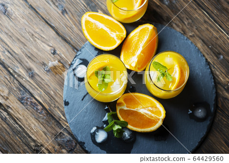 Fresh summer cocktail with orange and mint Fresh summer cocktail with orange and mint 64429560